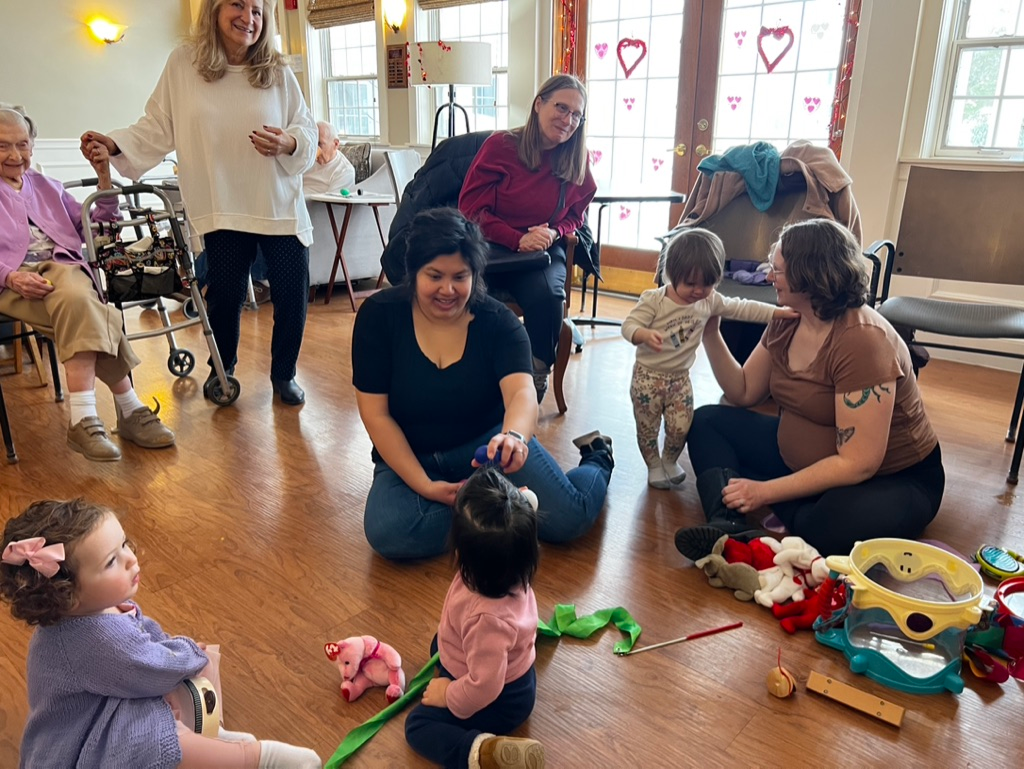 Families and residents making music together in a Bach & Boogie class